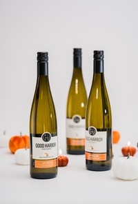 A trio of Good Harbor Vineyards wines nestled with orange & white pumpkins in Lake Leelanau, MI